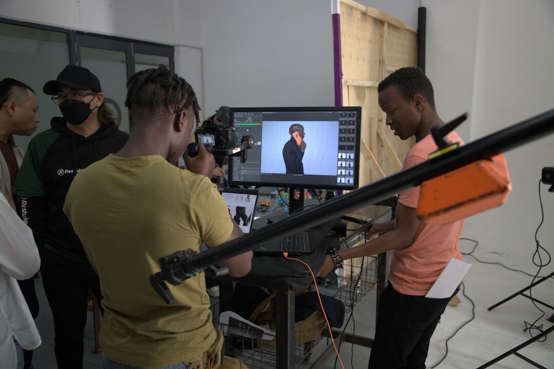 Students in a broadcast production training workshop with cameras and monitors